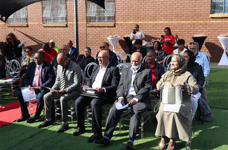 People sitting at the assembly of the school