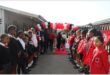 Learners waiting at the entrance of the school to welcome guests