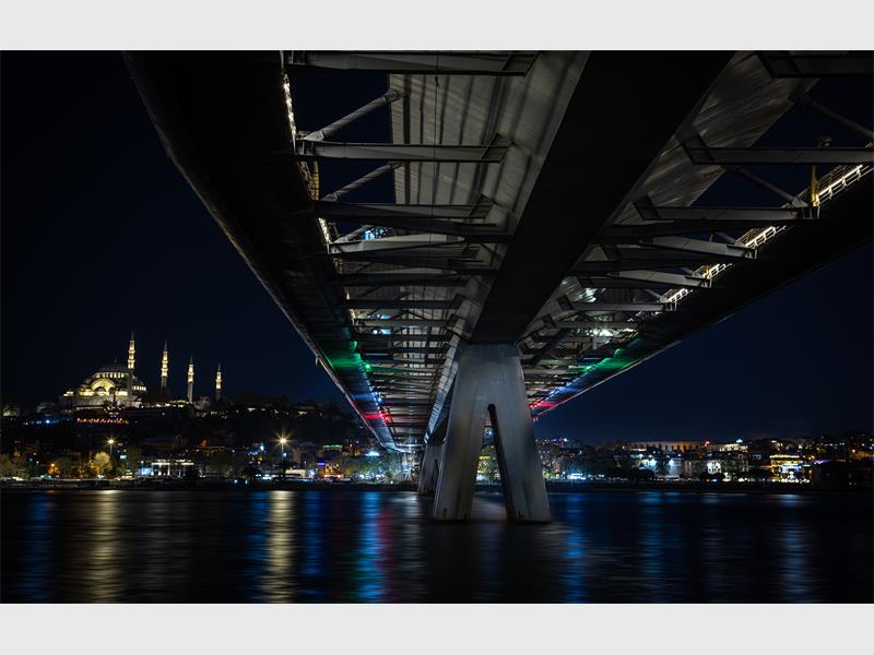 A night photo taken under a bridge.