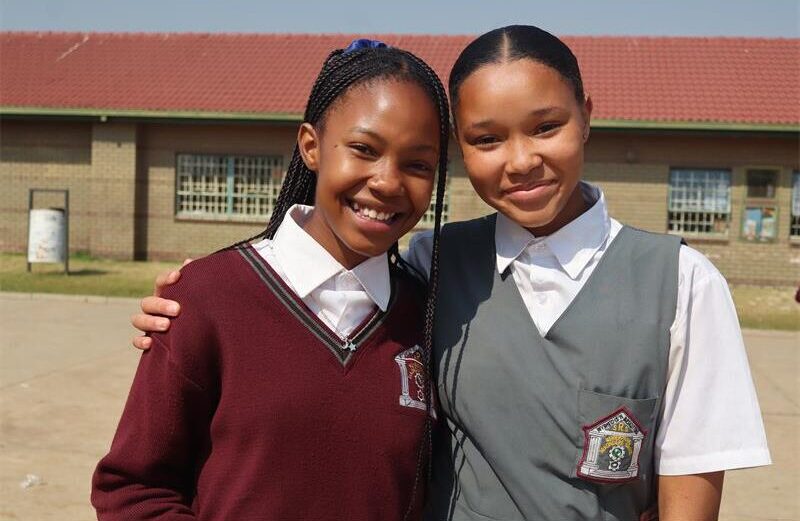 Two girls in school uniform