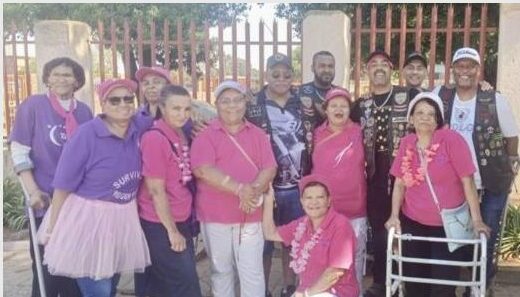 Group of coloured women wearing pink and purple