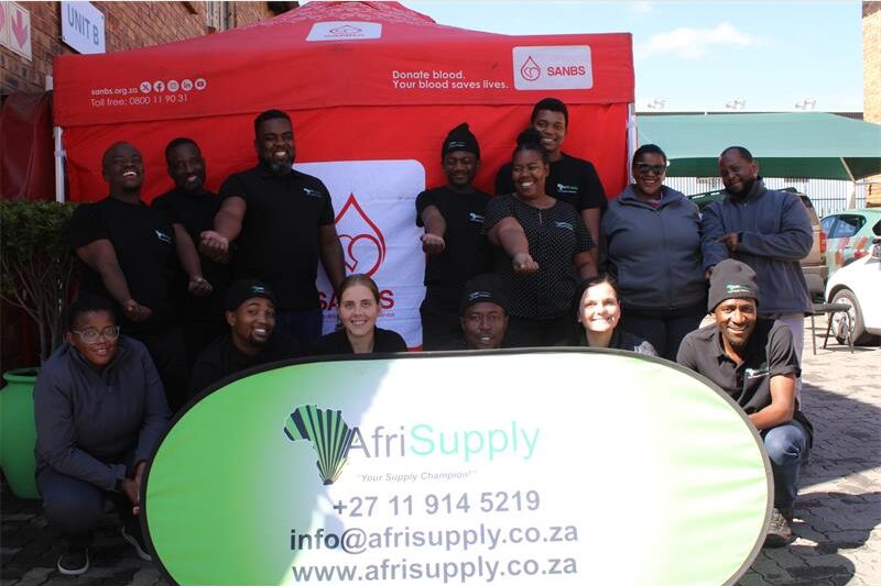Group of people posing in front of an SANBS gazebo