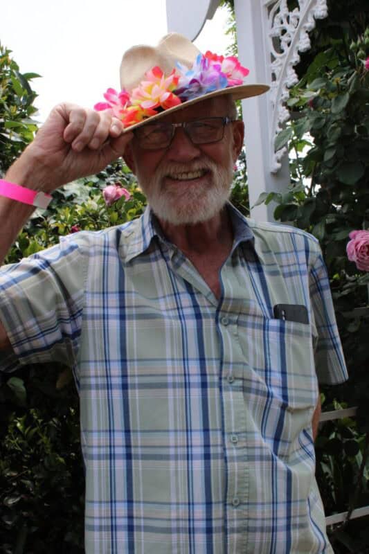 Man wearing a floral hat