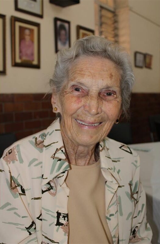 Elderly woman smiling at the camera