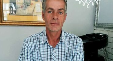 A man in a blue shirt