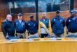 EMPD officers standing behind a table
