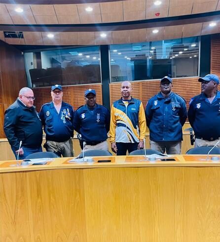 EMPD officers standing behind a table