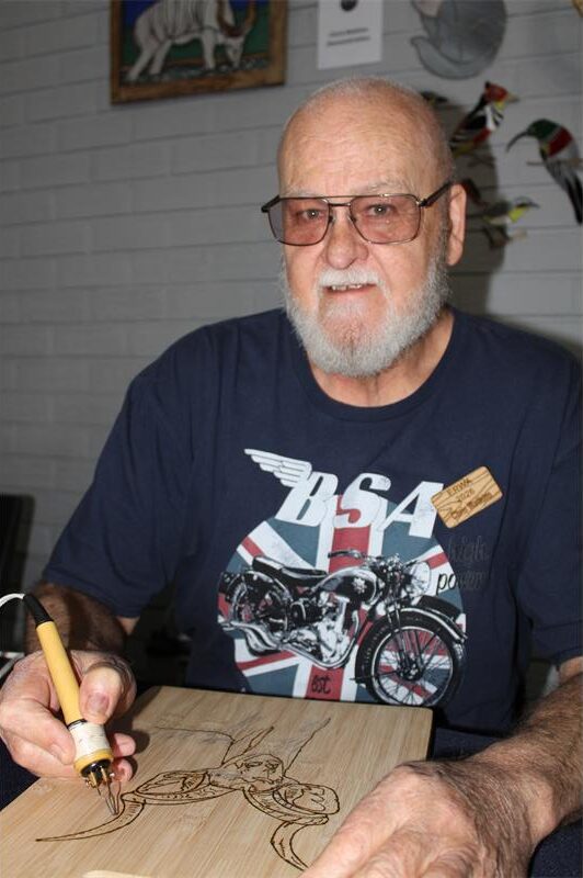 Man holding a soldering pen