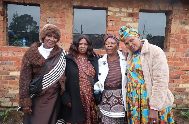 Old ladies wearing brown traditional dress.