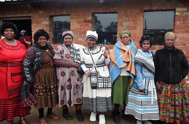 A group of black ladies wearing different types of trado
