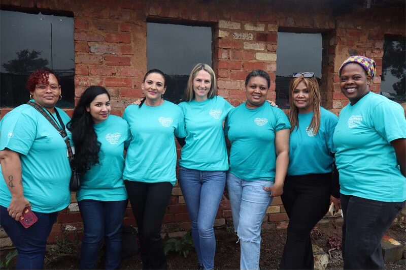 Ladies wearing light blue tops and blue jeans