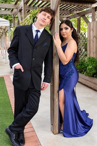 Boy and girl wearing evening wear