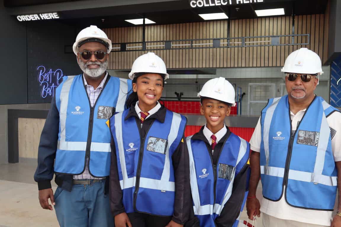 Adults and kids wearing hard hats