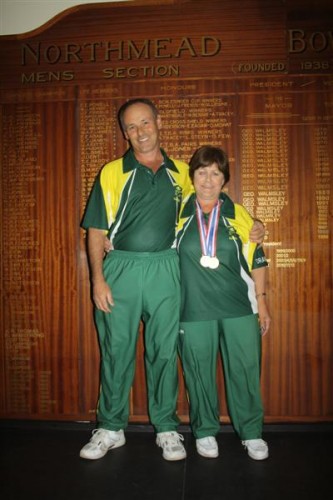 Paul and May Homer in front of the Northmead Bowling Club’s honours board. The husband and wife duo brought home gold from the World Bowls Championship in England.