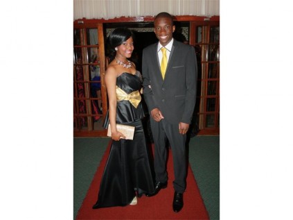 Terrecia Ntimane and Thavha Nesengani at the Gekombineerde Skool Noorderlig's matric farewell, in black and gold evening wear.