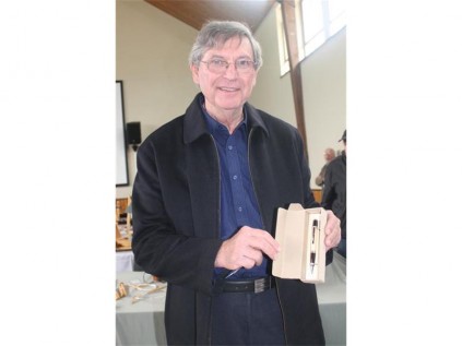 Chairman of the East Rand Woodworkers Association Andre Oosthuizen, shows one of the wooden pens he has crafted.
