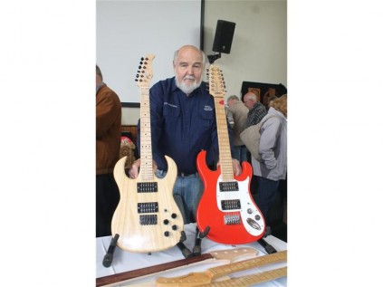 Peter Asselbergs exhibits his guitars at the woodworking fair.