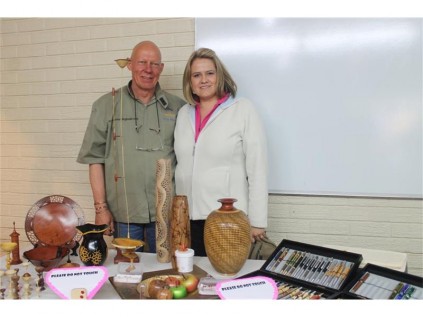 Dries and Adri Blignaut at their exhibition table, Dries performed woodworking demonstrations at the fair.