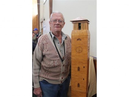 Jan van Wyk, with the model of the Campanile, that he built from 54 000 matches.