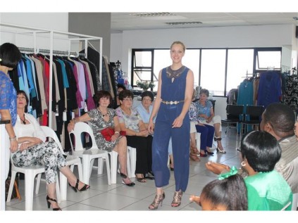 Modelling a stylish blue one piece down the runway.