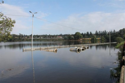A wall is almost completely submerged off Voortrekker Street.
