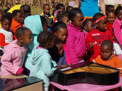 Children of NCCC admiring the toys Steffani donated (Medium)