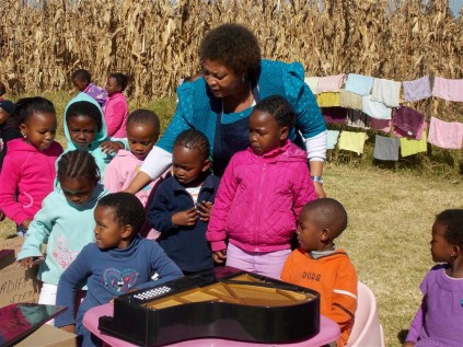 Ndazi Mtshwene(principal) with the children of NCCC (Medium)