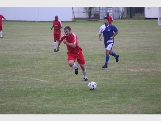 Football player Brogan Shrimpton is seen in action on the football field for the club.