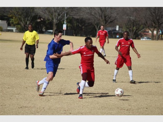 Northerns’ first team midfielder Tshatsho Molapo fends off a challenge from an Edenvale player as teammate Joel Nchableng looks on during last week Wednesday’s game.