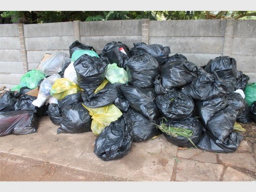 A pile of refuse from a housing complex on Uys Street, Rynfield.