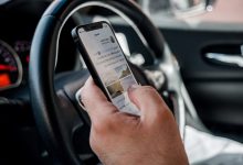 Hand holding cell phone