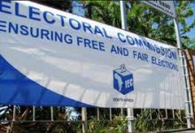 File image of IEC banner on a fence