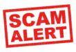 SCAM ALERT red Rubber Stamp over a white background.