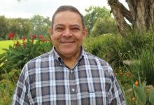 Indian man standing in a garden