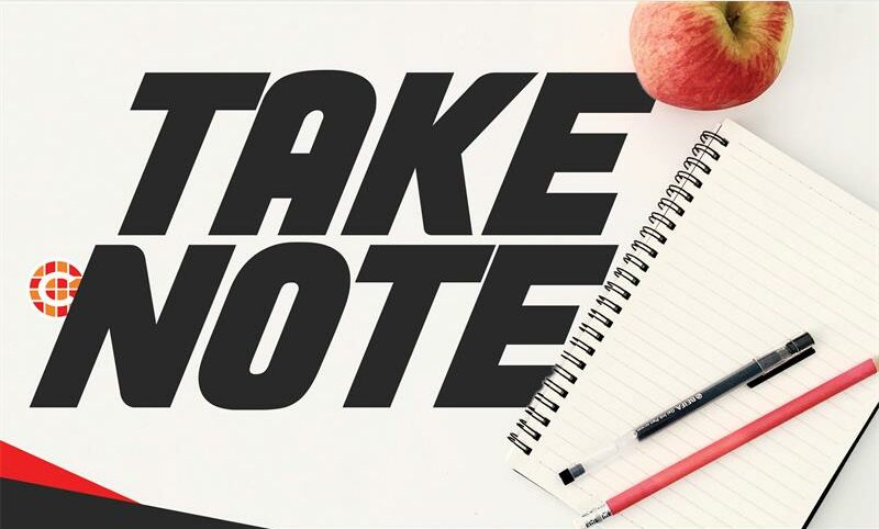 Notepad with two pens and words 'Take Note'