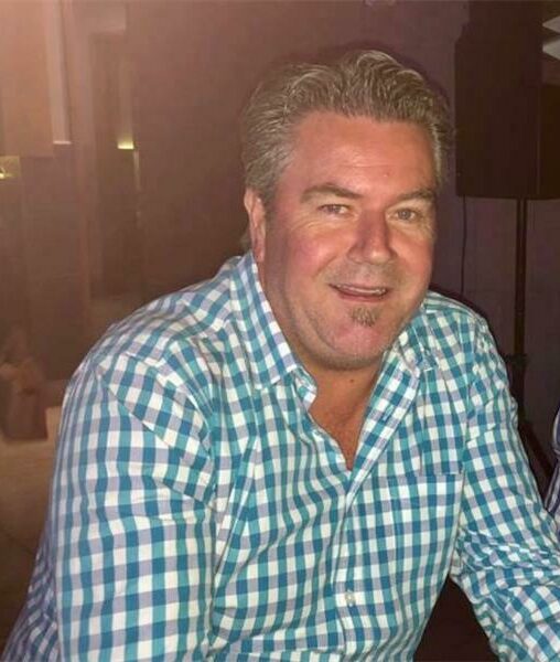 Man wearing a checkered blue and white shirt