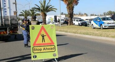 A road sign cautioning against police presence