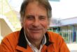 Man wearing an orange jacket