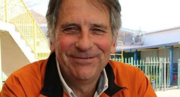 Man wearing an orange jacket