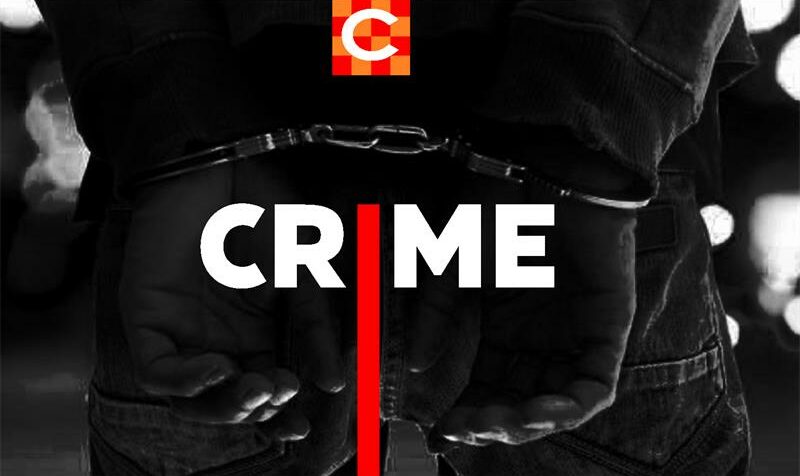 Blackkend image showing hands in handcuffs