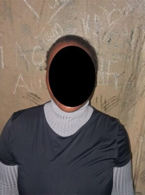 A blacked out photo of a woman who allegedly assaulted a family member.