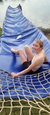 Photo of a Kim Bailey preparing to slide into Homestead Dam.