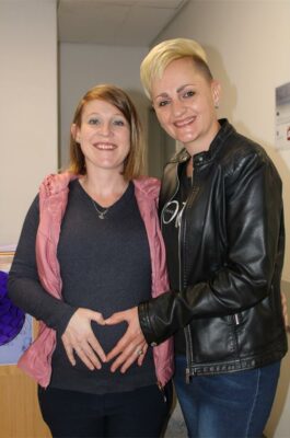 Two women standing side-by-side