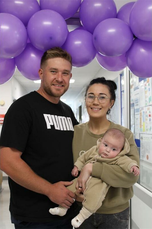 Man and woman holding a baby