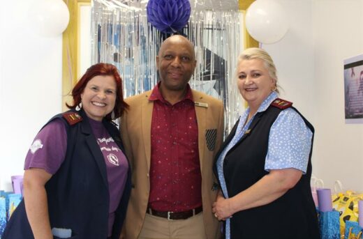 Two white nurses flanking a black man