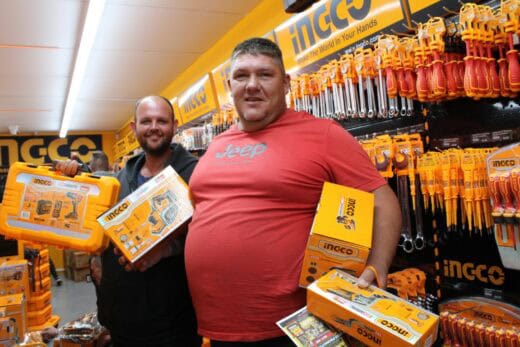 Two men holding boxes
