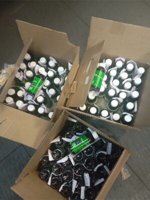 Three boxes containing medicine bottles.