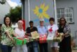 Group of women holding Christmas gifts