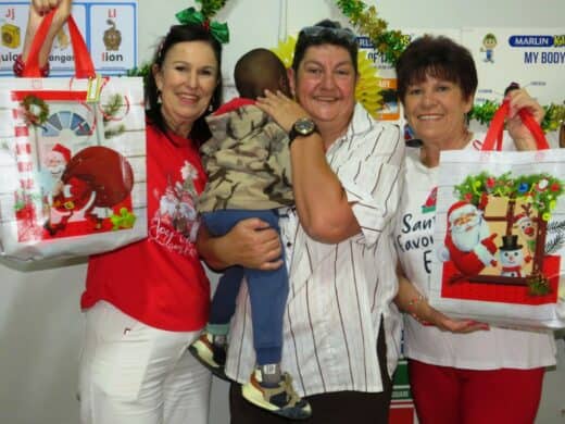 Three women, one holding a boy