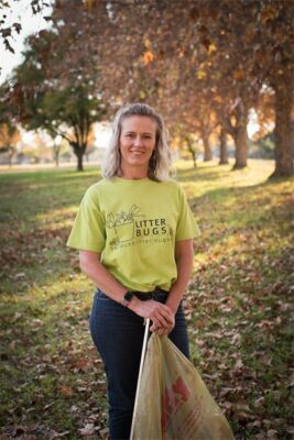 Blonde woman wearing a lime green T-shirt.